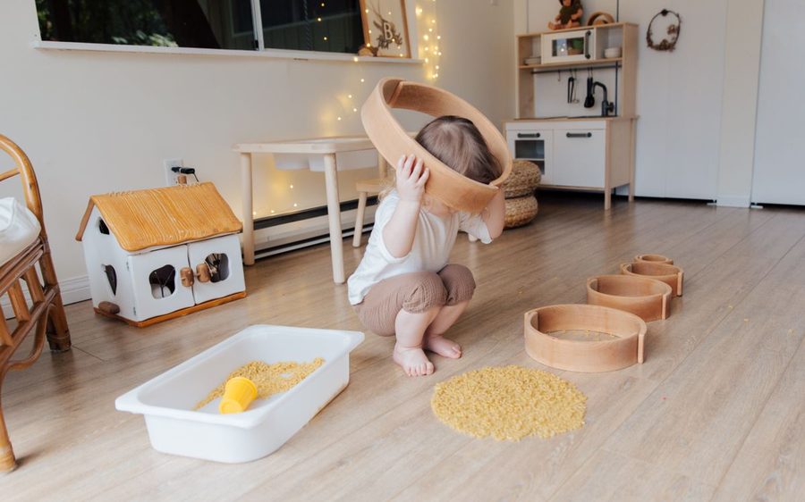 A toddler exploring sensory play at a class